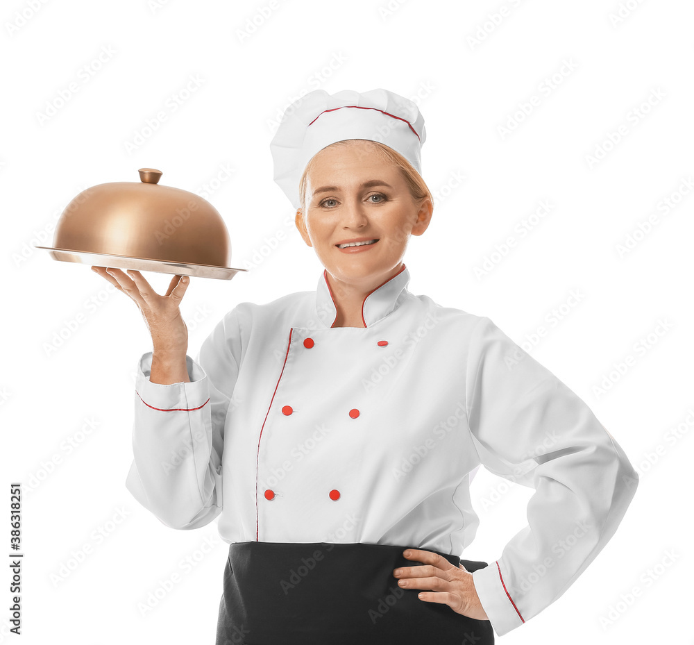 Mature female chef with tray and cloche on white background