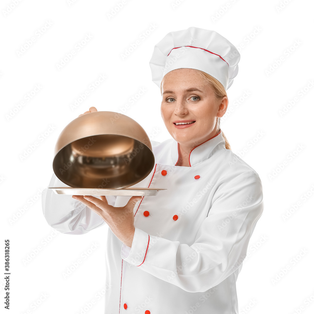 Mature female chef with tray and cloche on white background