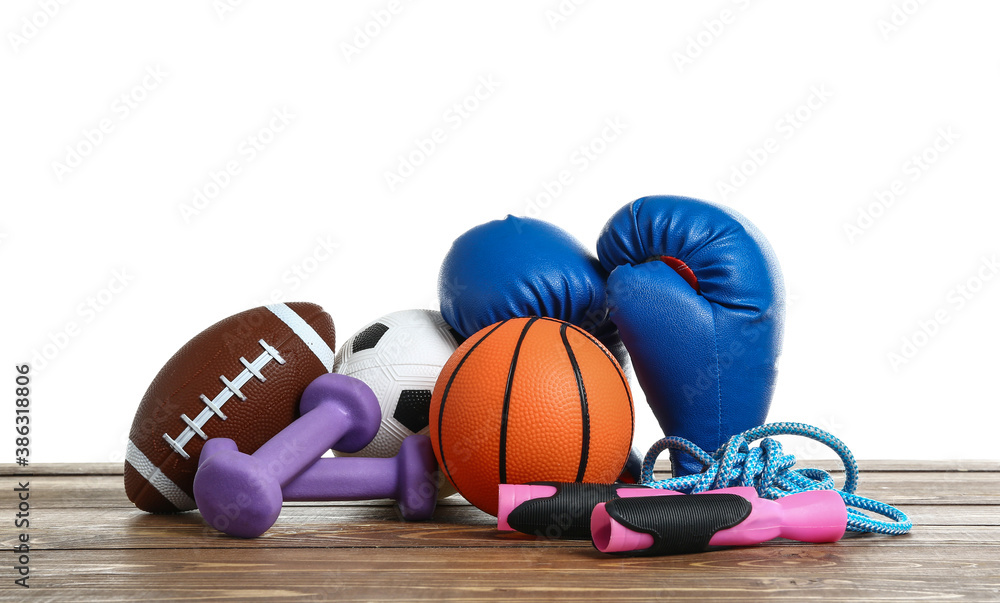 Set of sport equipment on table against white background