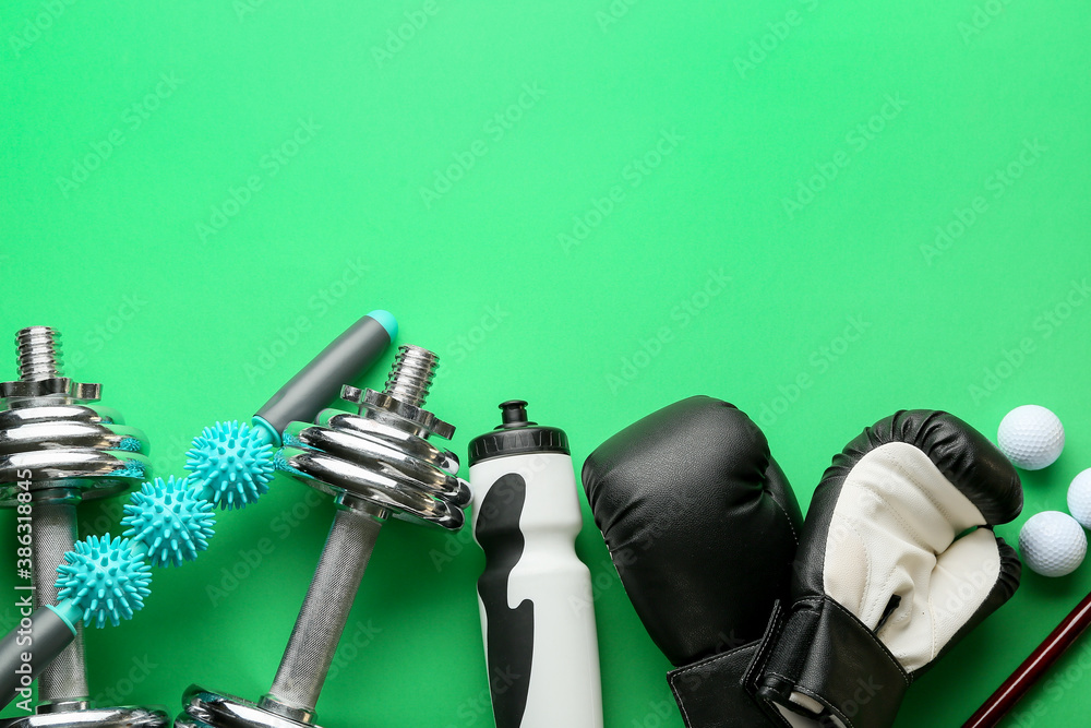 Set of sport equipment on color background