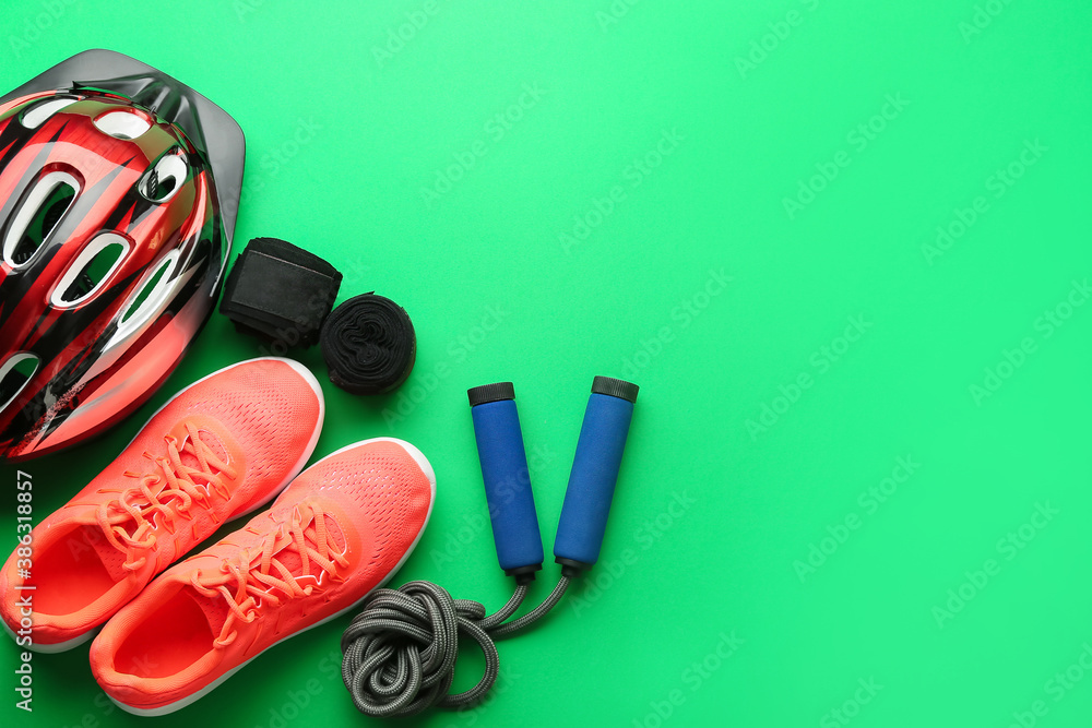 Set of sport equipment on color background