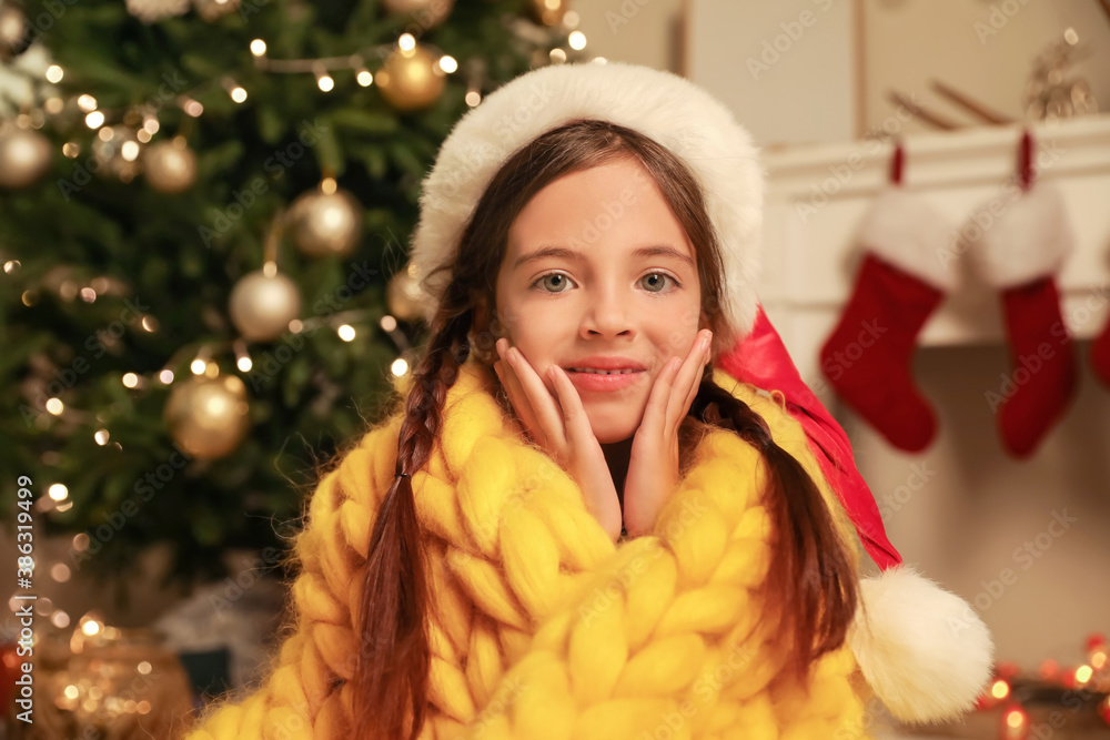 Cute little girl at home on Christmas eve