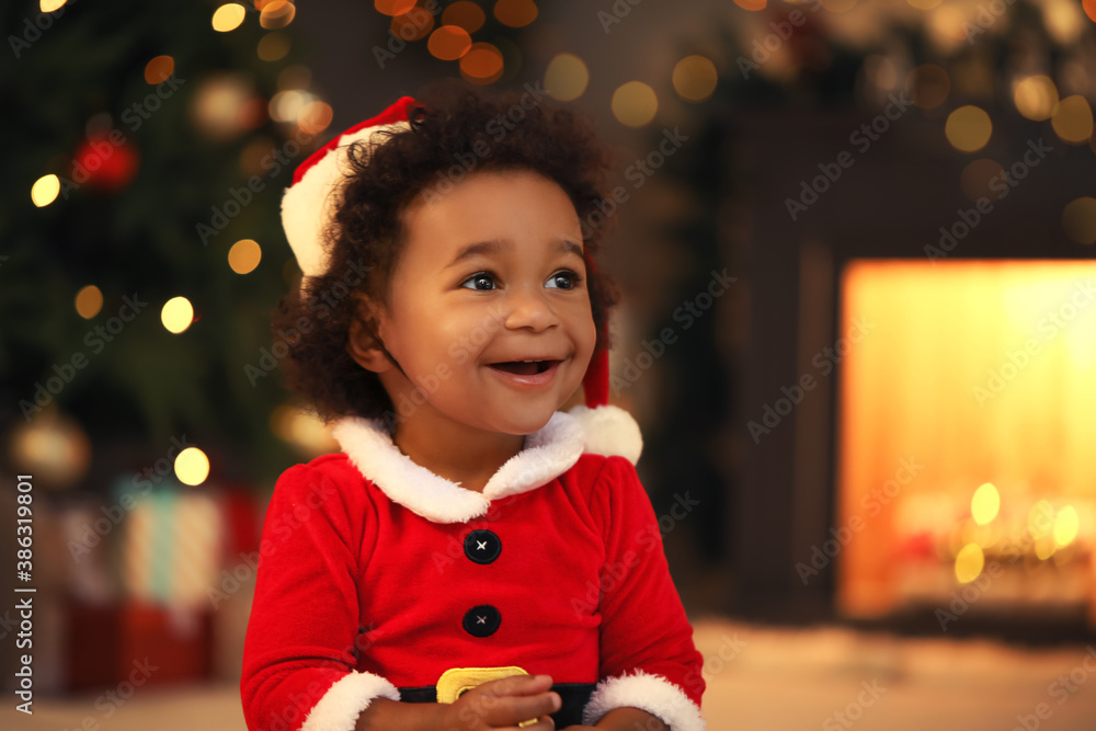 Cute African-American baby girl at home on Christmas eve