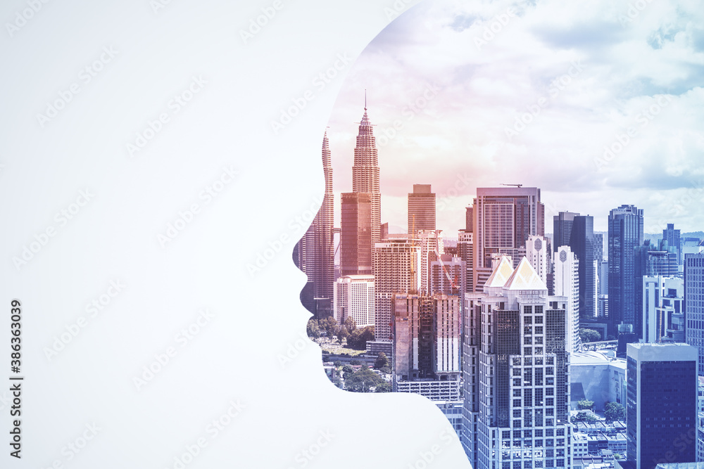 Abstract head silhouette on blurry city background.