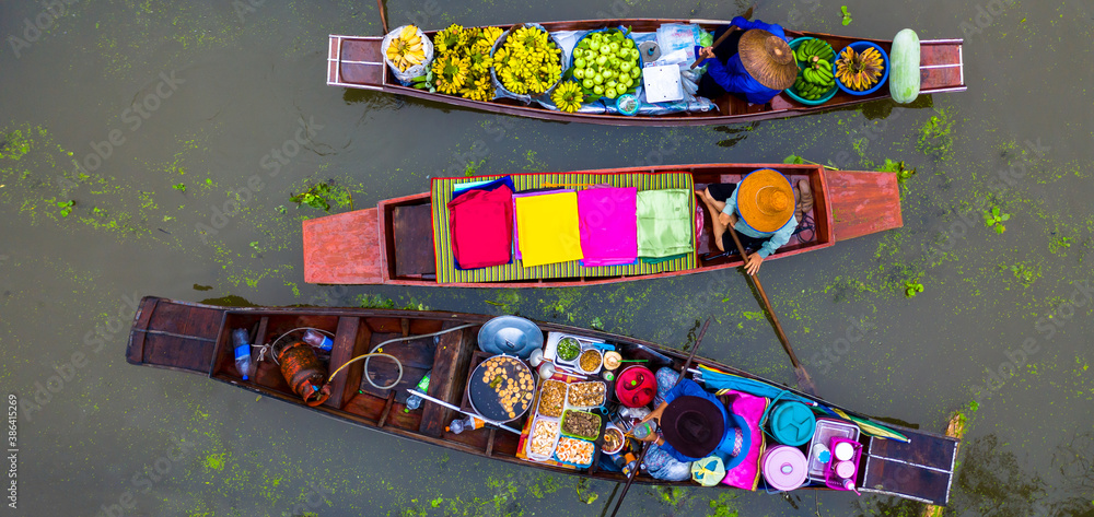 Aerial view famous floating market in Thailand, Damnoen Saduak floating market, Farmer go to sell or