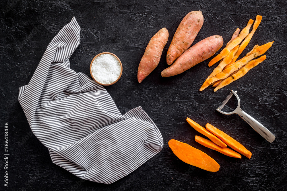 Sliced sweet potato on cutting board, top view