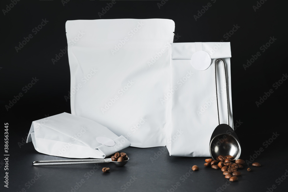 Blank coffee bags on dark background