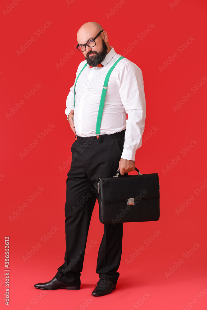 Overweight businessman on color background