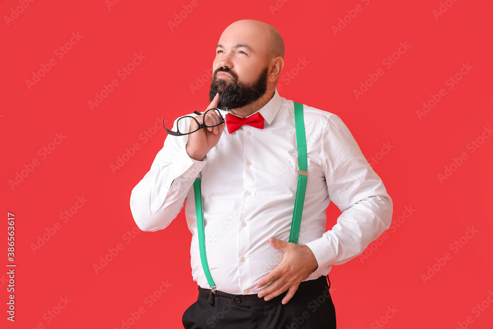 Overweight businessman on color background