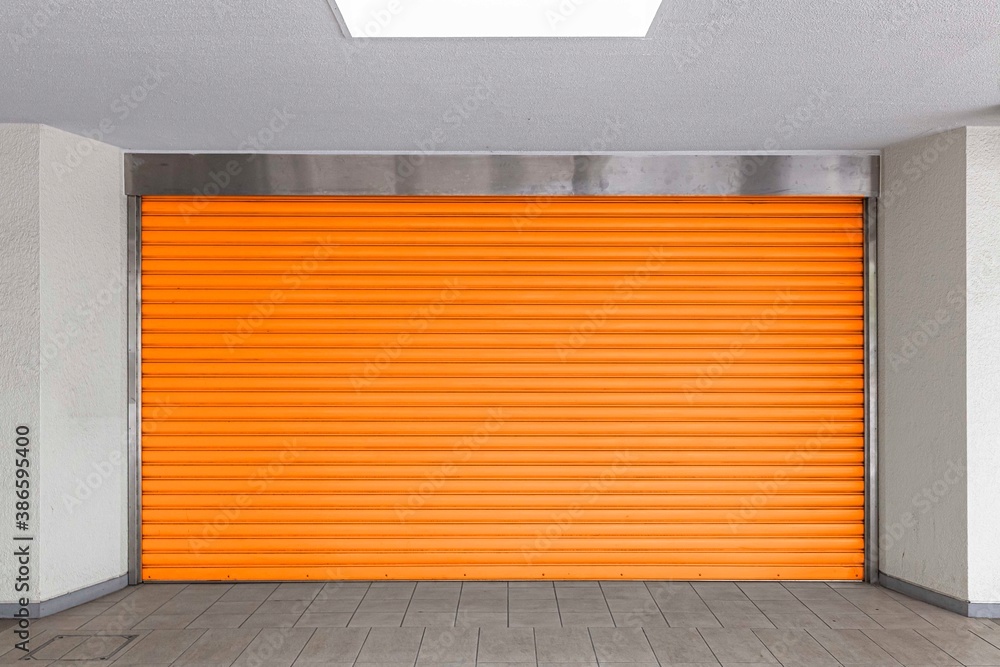 A brown shutter door close at an industrial warehouse