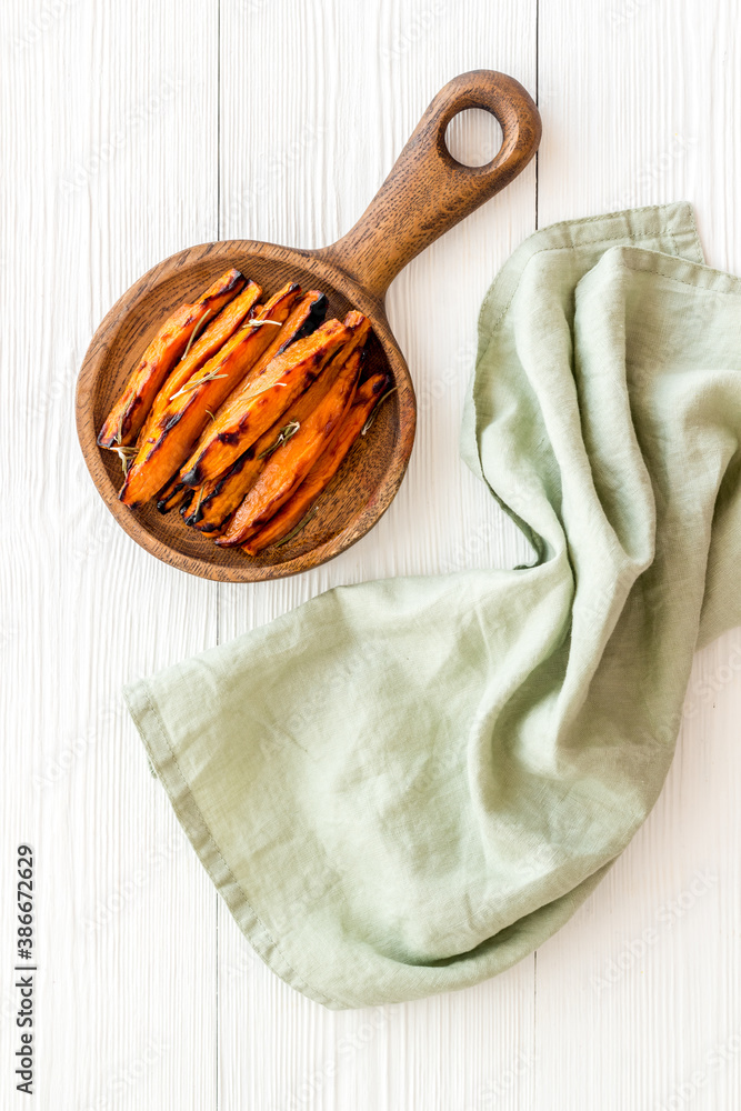 Top view of sweet potato fries with herbs and spices