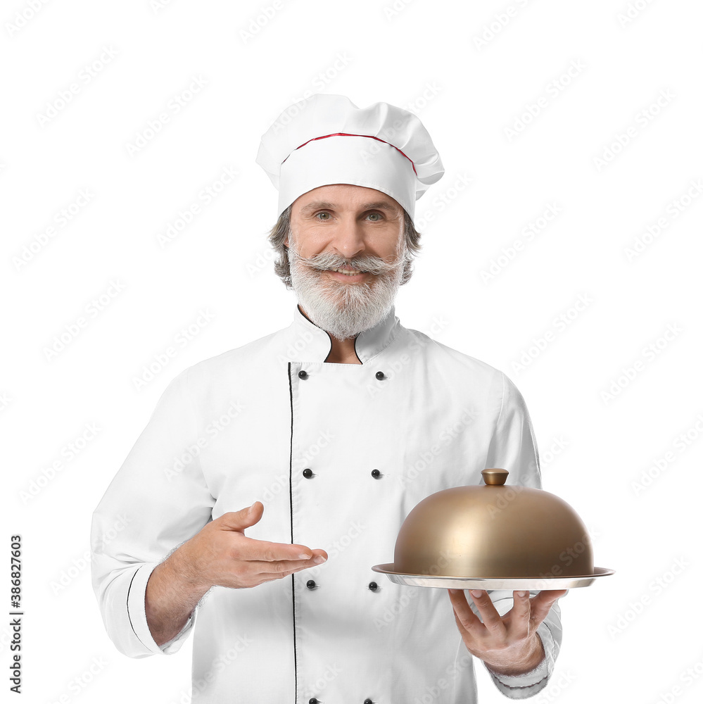 Mature male chef with tray and cloche on white background