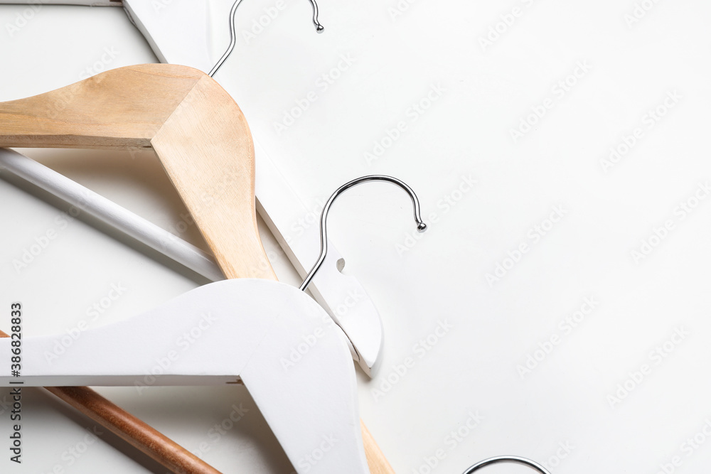 Clothes hangers on light background