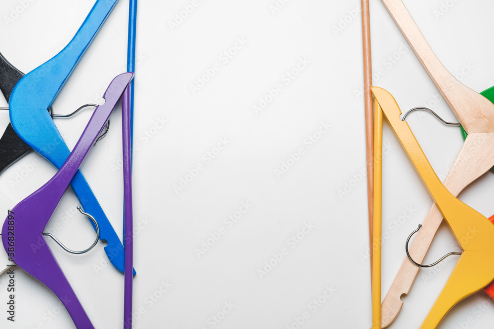 Clothes hangers on light background