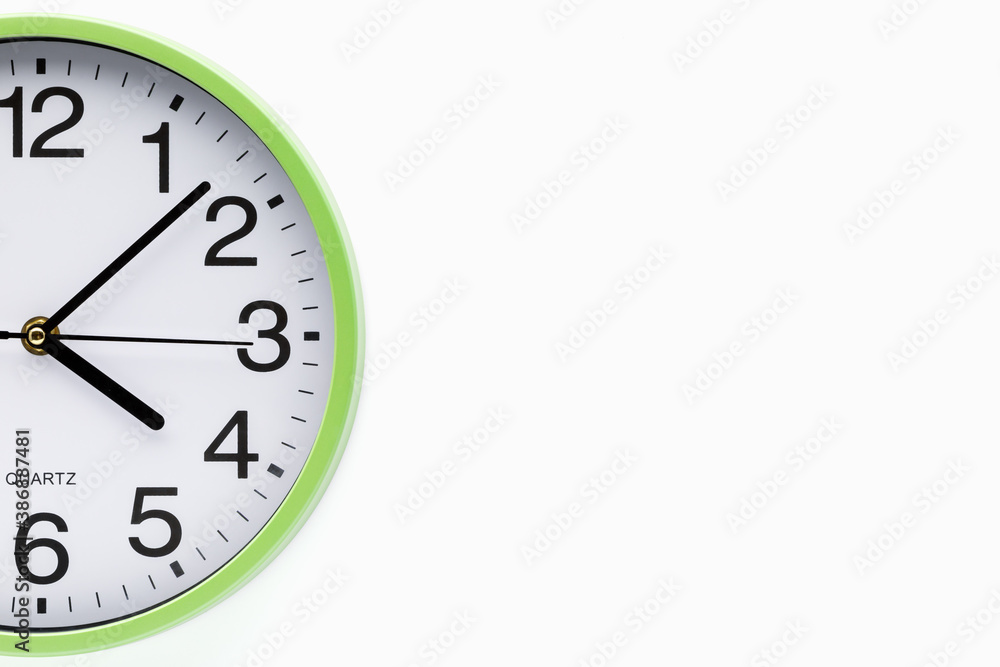 Part of the clock on white background. Copy space. Clipping path included