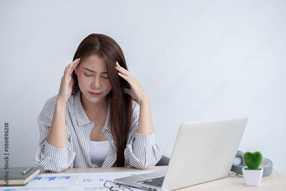 Asian women are bored from their online studies, have a sad face and have been tired from their stud