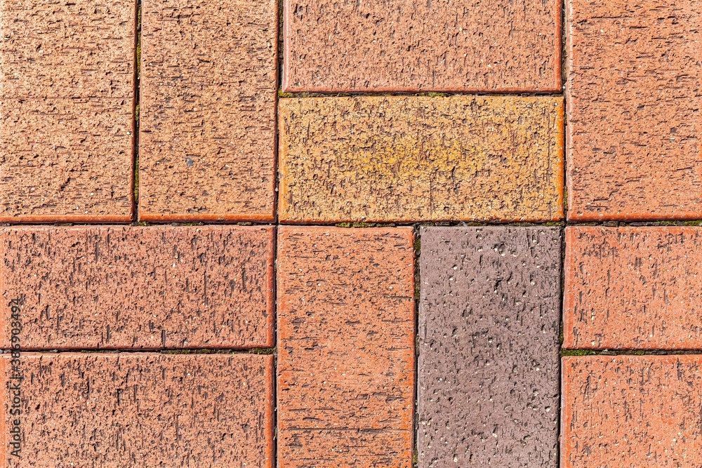 Vintage brown cobblestone pavement pattern and background