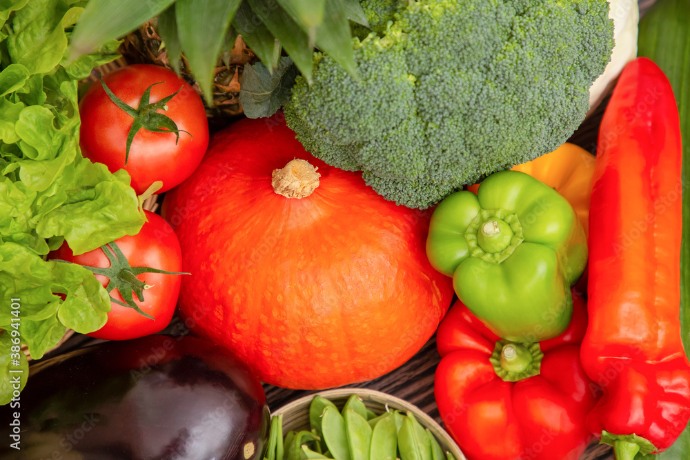 Group vegetables and Fruits Apples, grapes, oranges, and bananas in the wooden basket with carrots, 