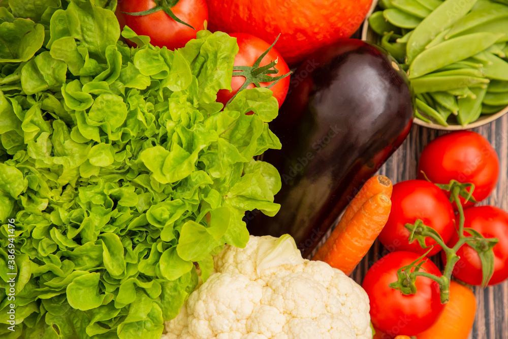 Group vegetables and Fruits Apples, grapes, oranges, and bananas in the wooden basket with carrots, 