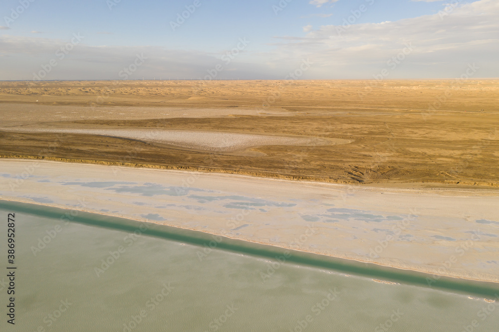 Salt lake with wide flatlands background.