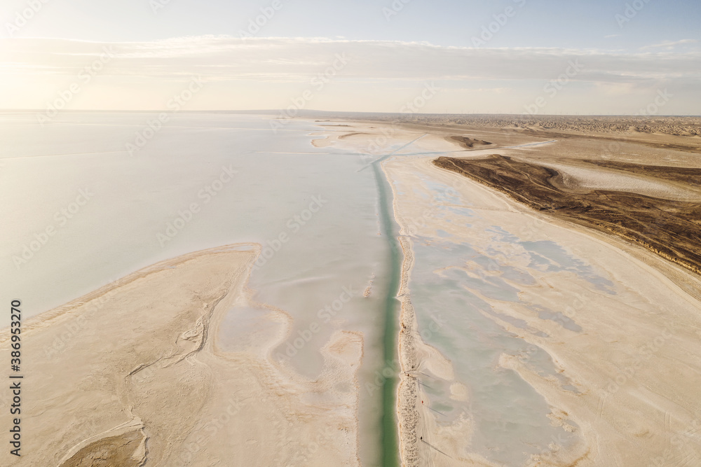 Salt lake with wide flatlands background.