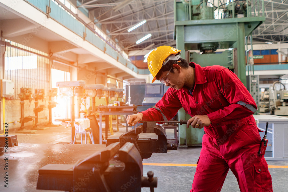 Asian man foreman working with rasp machinery with safety uniform concept smart manufacturing indust