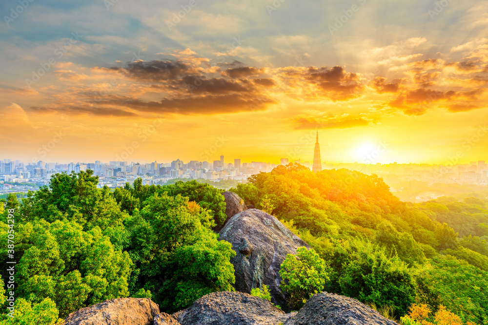 Ancient Baochu Pagoda.Chinese traditional architecture and modern city skyline in Hangzhou at sunris