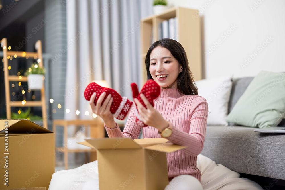 woman open online shopping parcel