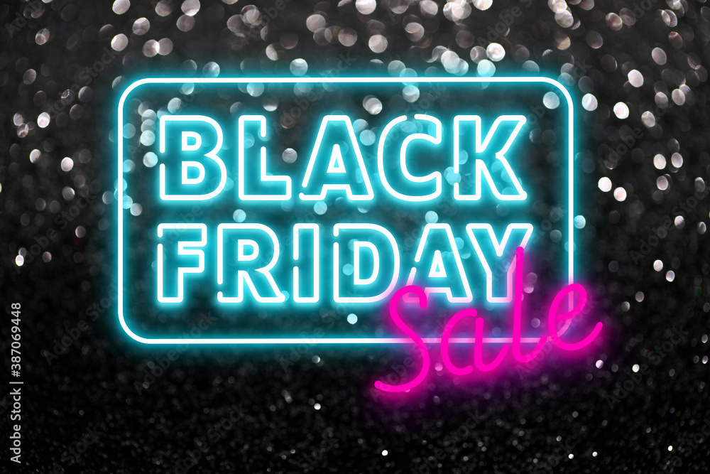 Text BLACK FRIDAY SALE on dark background with glitters