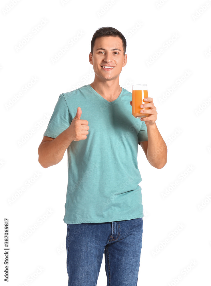 Handsome man with orange juice on white background