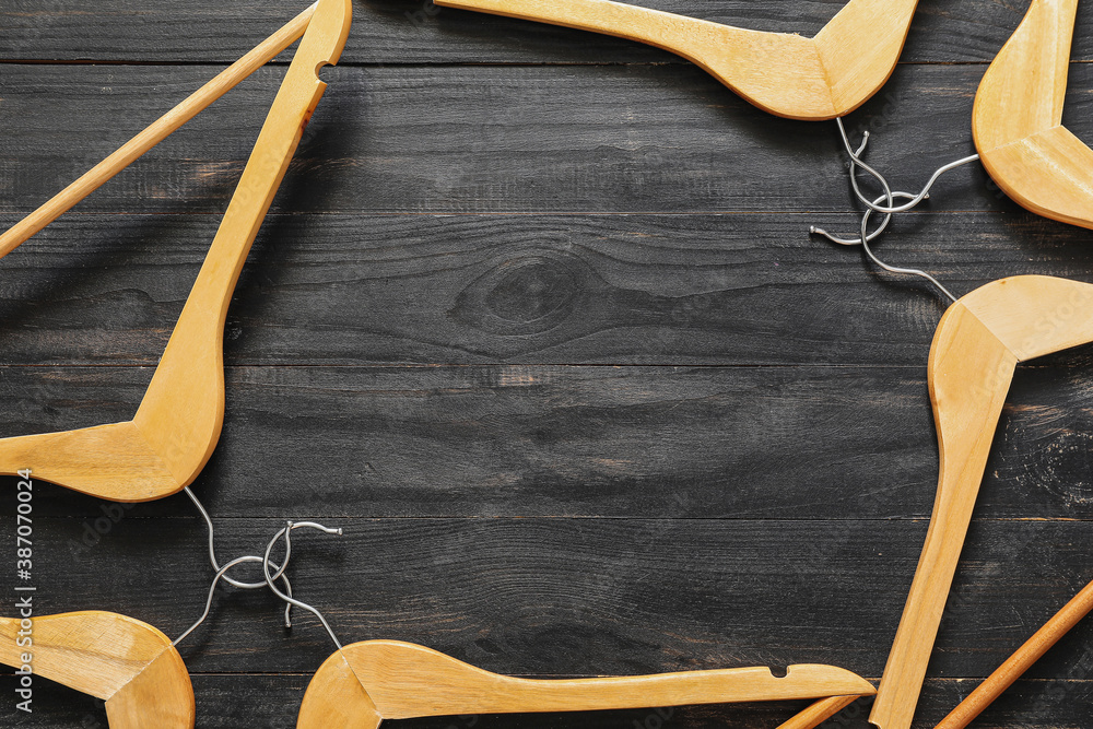 Clothes hangers on dark background