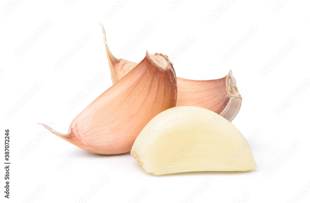 Close-up Peeled Garlic Cloves isolated on white background. Clipping path.