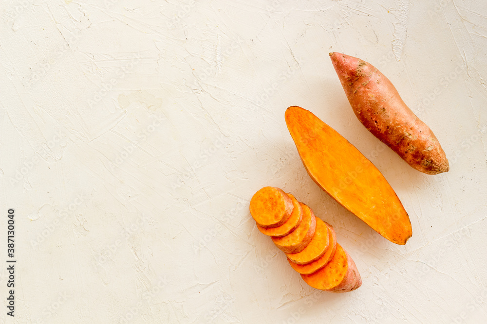 Sliced sweet potato on kitchet table, top view