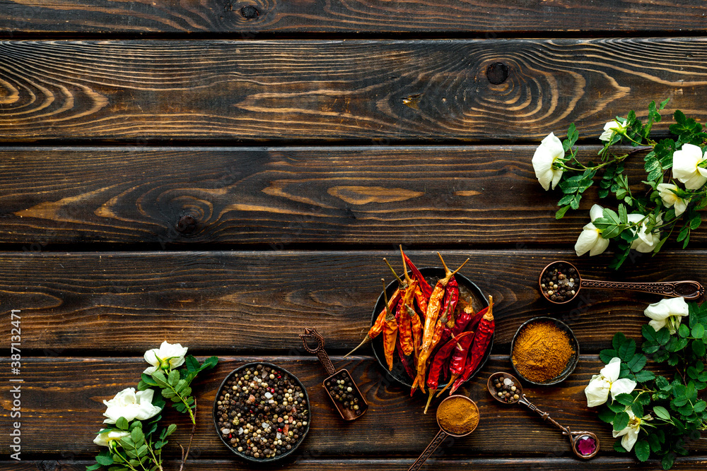 Various aromatic and hot spices with herba and flowers, view from above