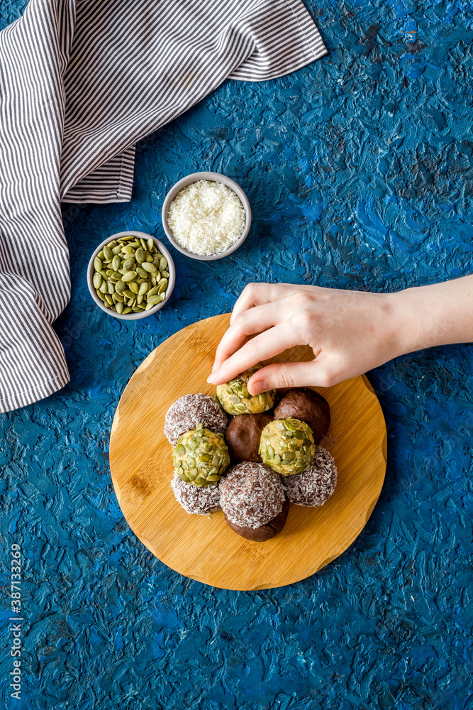 Top view of raw vegan energy balls with nuts and cacao