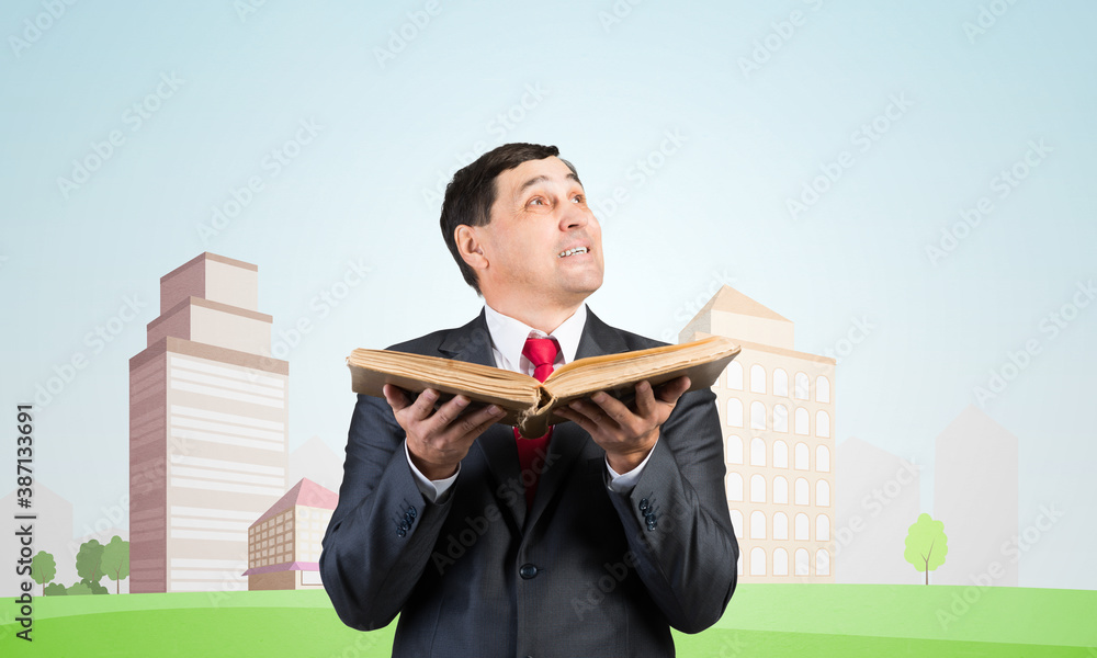 Senior businessman holding open book