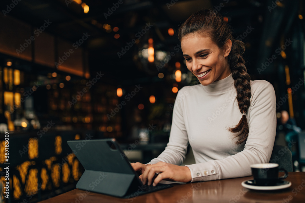 Smiling face, sitting at cafe.