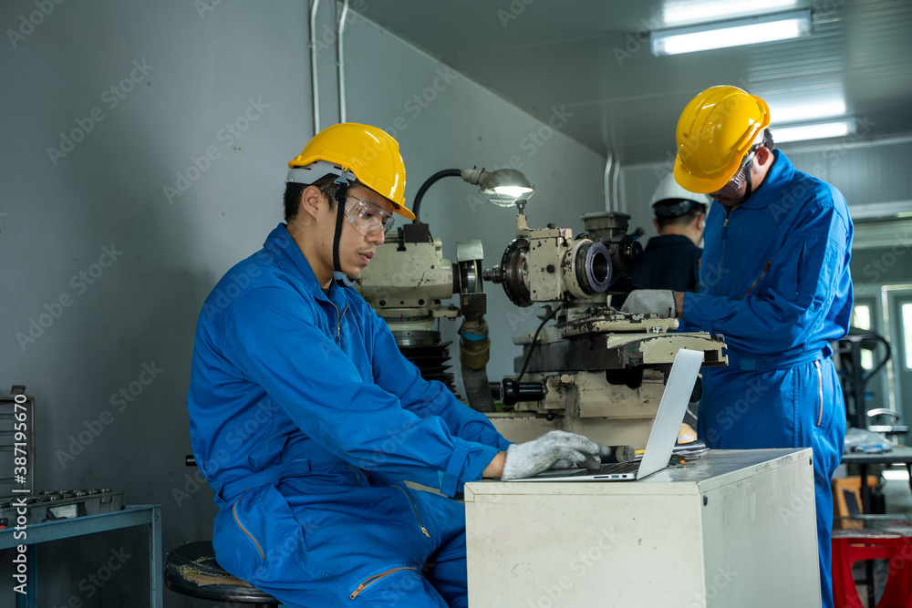 The industrial worker team working in factory with the machine.