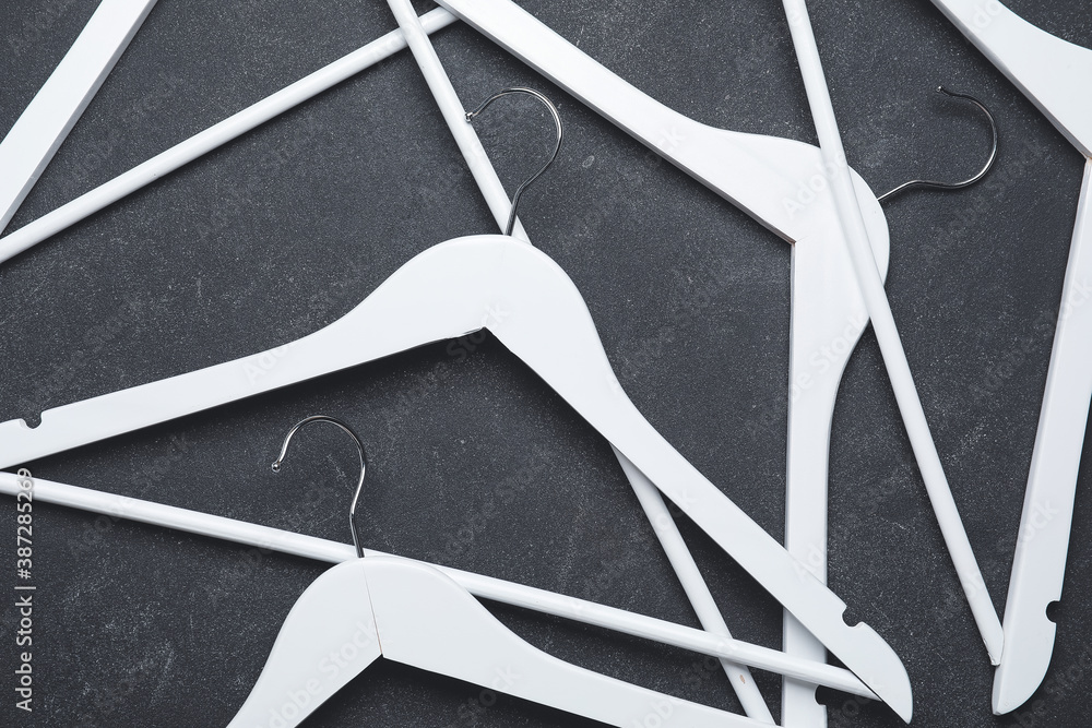 Clothes hangers on dark background