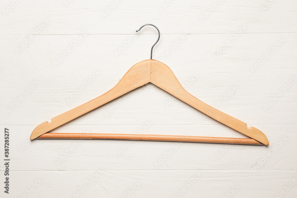 Clothes hanger on wooden  background