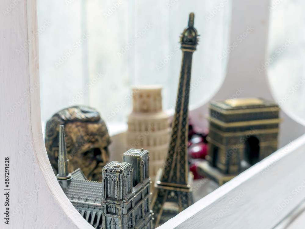 A wooden box with souvenirs from Europe as travel background.
