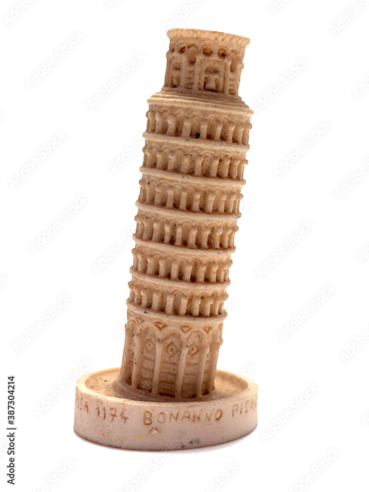 A plaster copy of the the Leaning Tower of Pisa. Object is isolated on the white background.