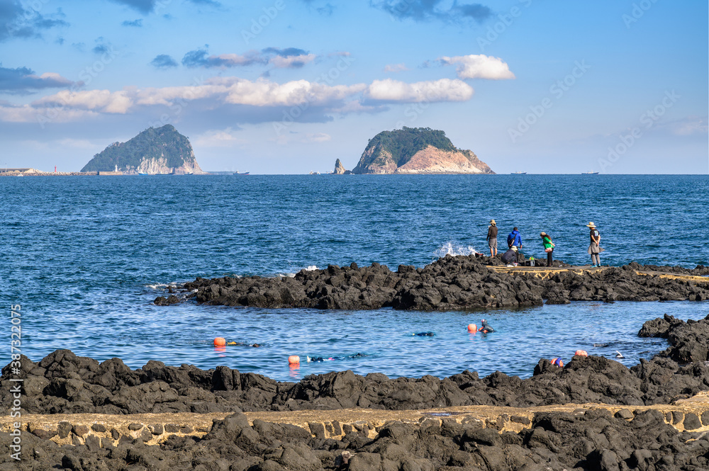 Jeju Island is Koreas leading tourist destination. This is a coastal walkway where you can see two 