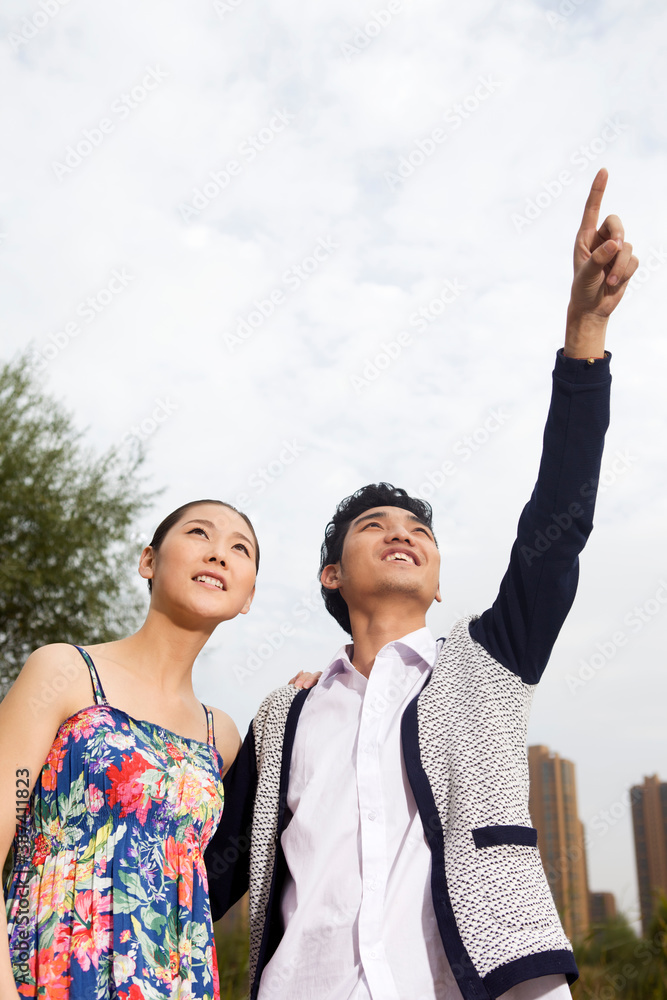 A young couple in the park for an outing