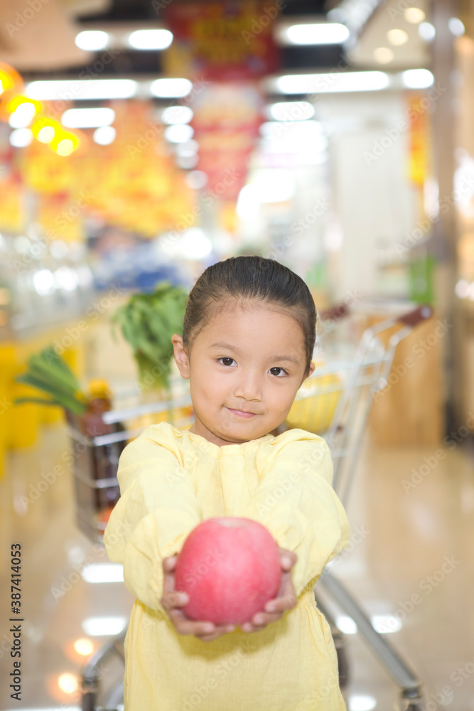 A cute little girl in the supermarket