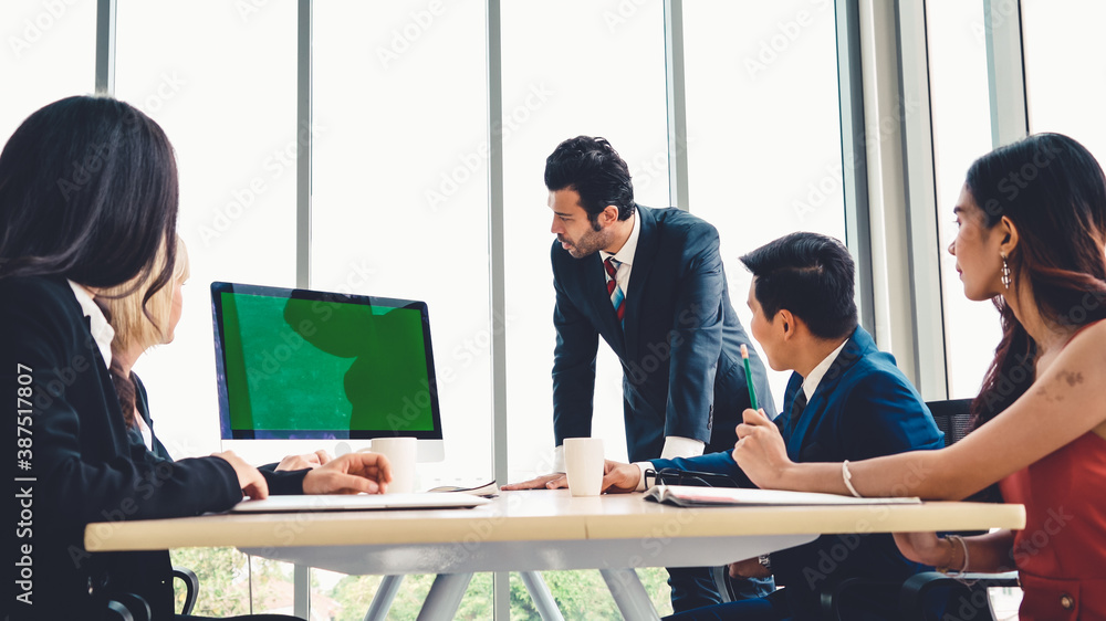 Business people in the conference room with green screen chroma key TV or computer on the office tab