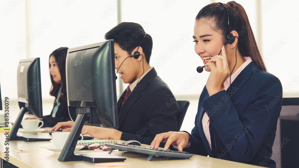 Business people wearing headset working in office to support remote customer or colleague. Call cent