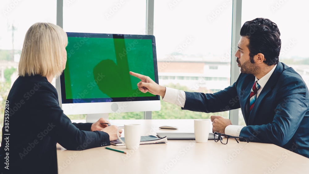 Business people in the conference room with green screen chroma key TV or computer on the office tab