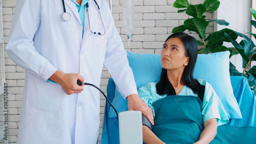 Doctor in professional uniform examining patient at hospital or medical clinic. Health care , medica