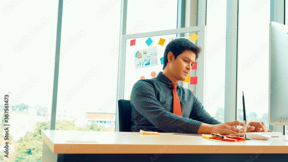 Business people working at table in modern office room while analyzing financial data report .